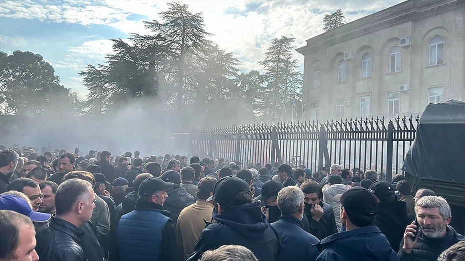 Protesters storm Putin-backed parliament in Georgia breakaway region