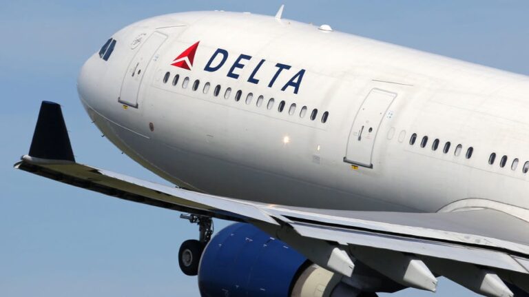 Delta passengers evacuate flight on emergency slides during aborted takeoff